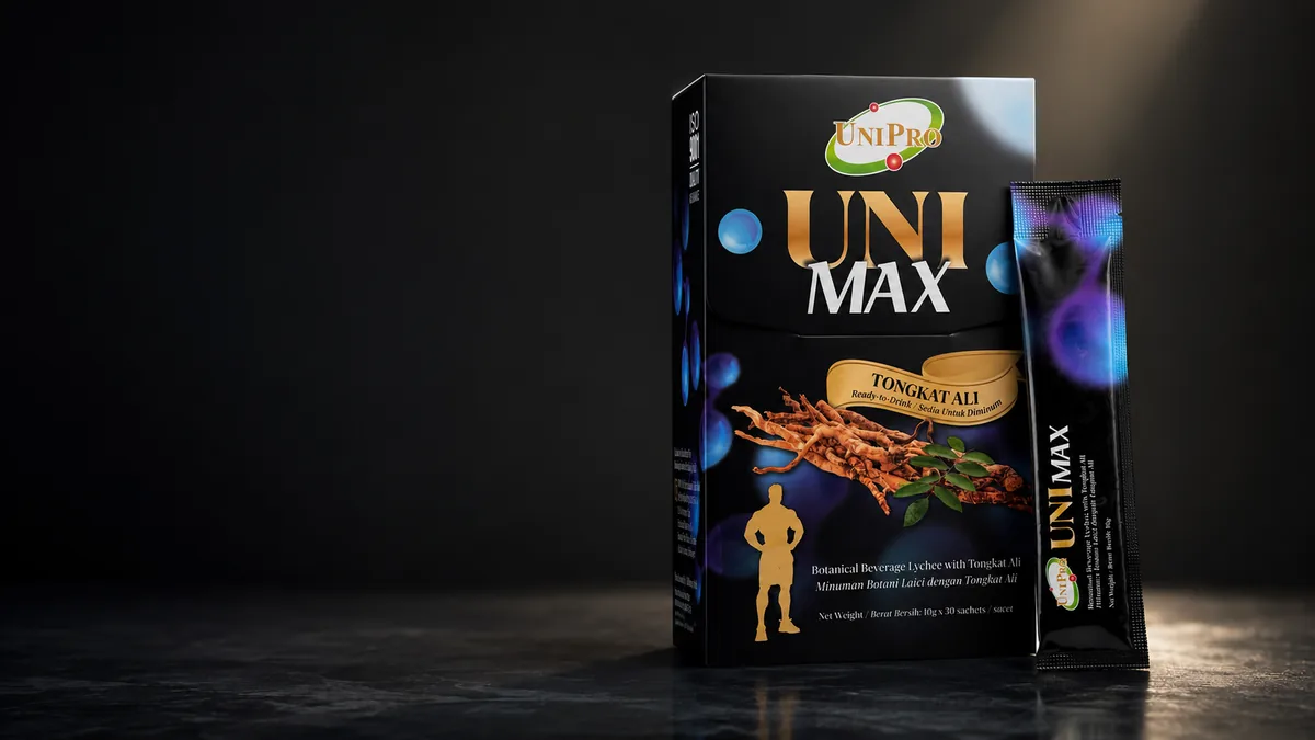 UNI MAX box and sachet in dramatic light on slate